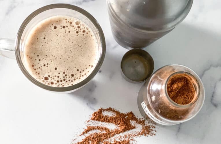 Coffee in a cup, shaker and spices