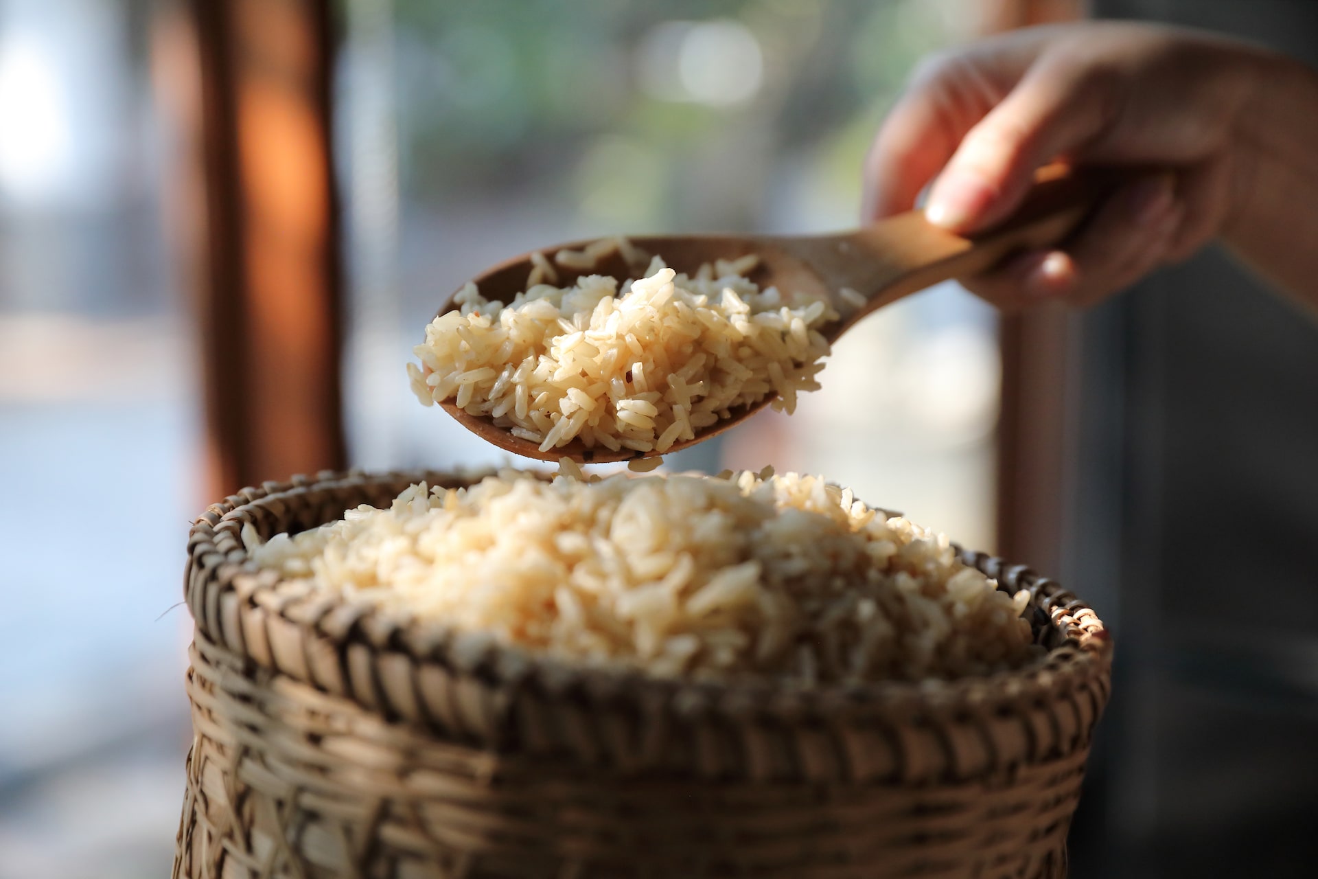 Close up of organic boiled brown rice on Wicker basket